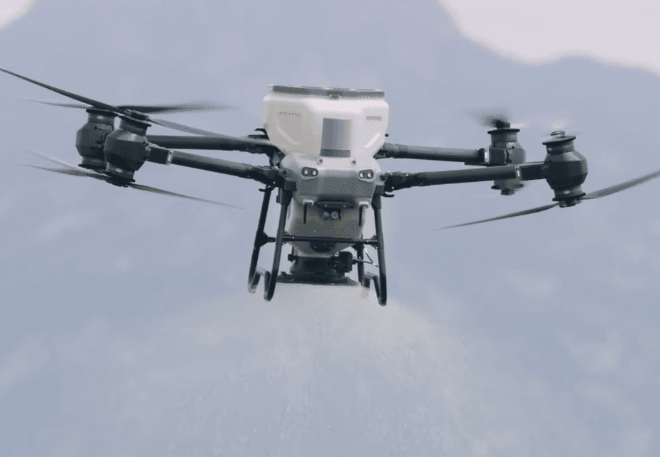 Drone spraying agricultural field