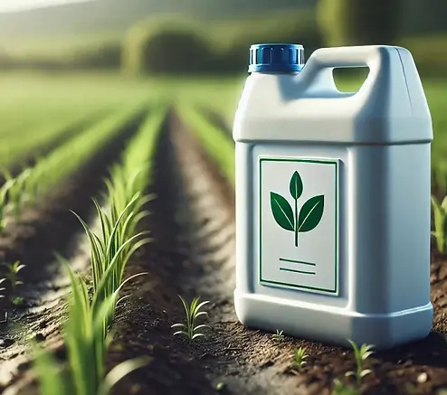 Liquid fertilizer bottle in crop field