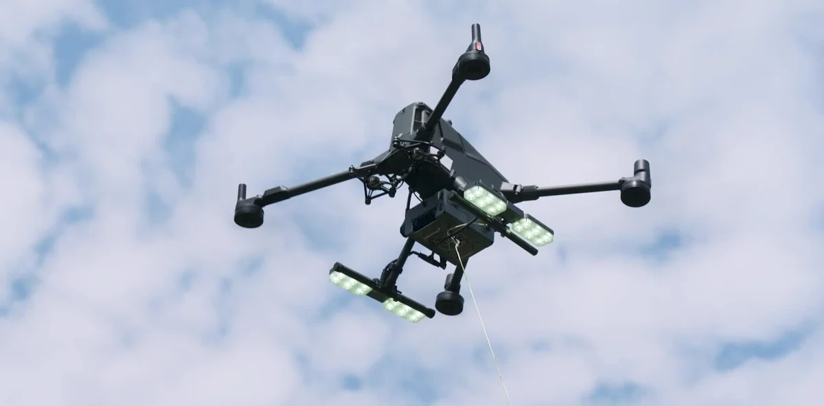 Tethered Matrice 400 in flight with a visible power cable